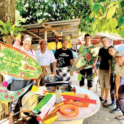 A group photo before flying the traditional kites.